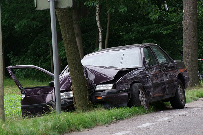 purple car crashed head on into a tree near the road 172922443 2600x1950