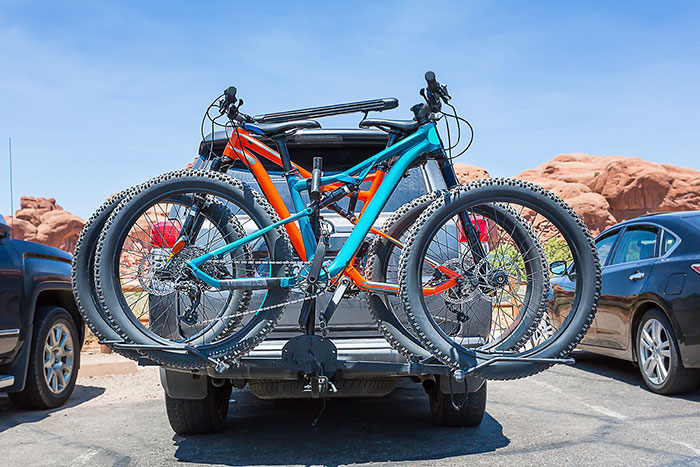bikes loaded on the back of a car 638346462 5760x3840