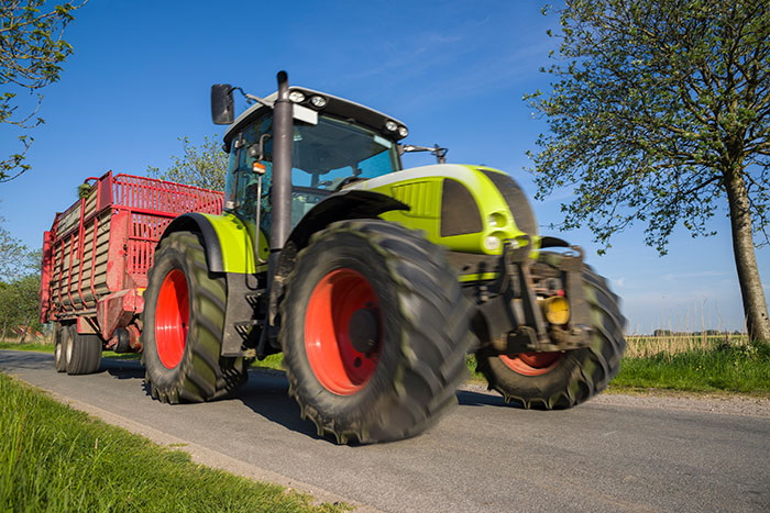 tractor with trailer on road under clear sky 542003128 6016x4016